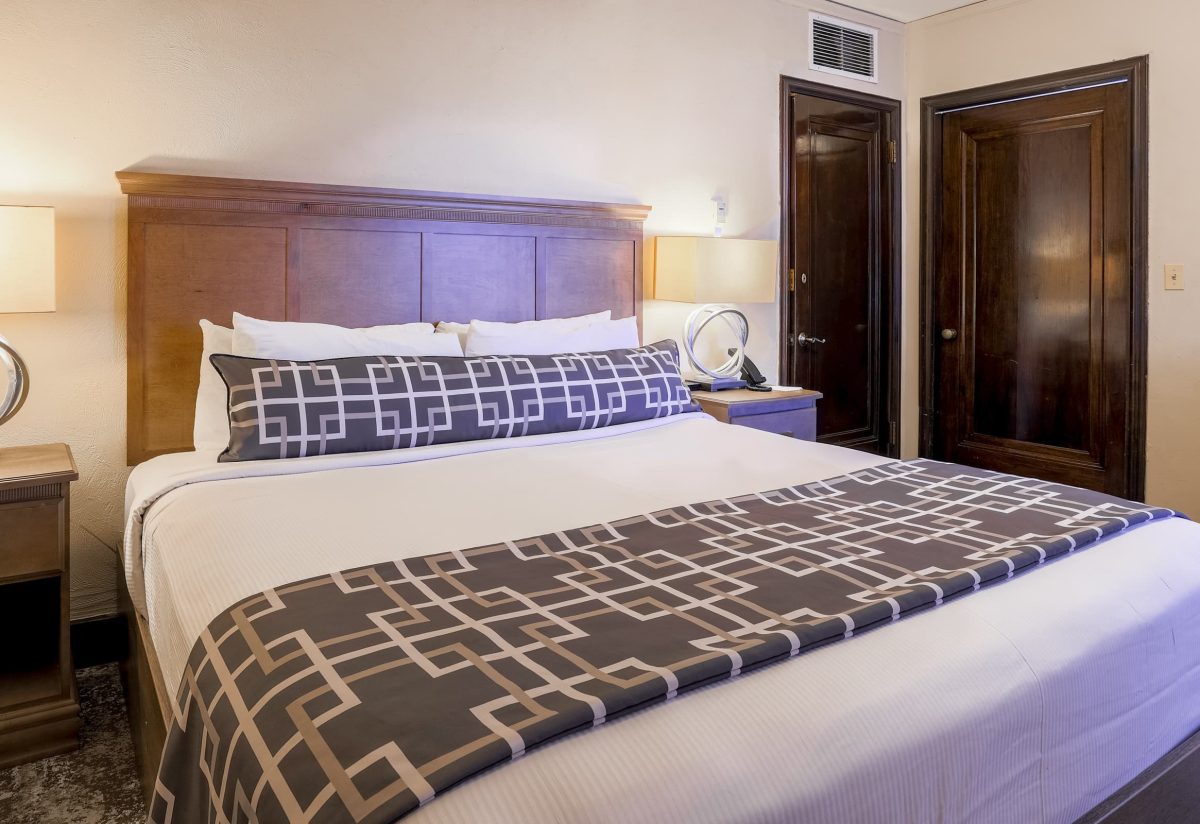 Bedroom of one bedroom suite at Hotel Baker offering one of the best places to stay in St. Charles, IL