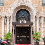 Front entrance with 1928 vintage stained glass peacock fanlight above the entry