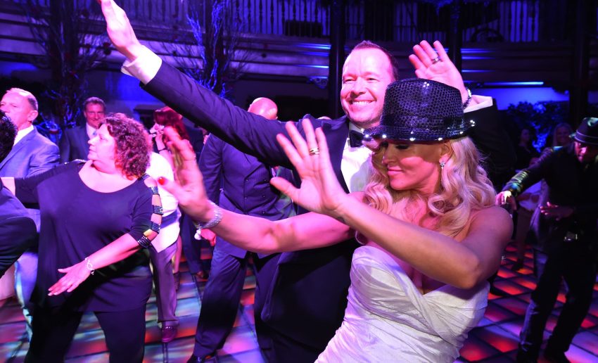 Donnie Wahlberg and Jenny McCarthy dancing in the Rainbow Room at Hotel Baker for their wedding reception