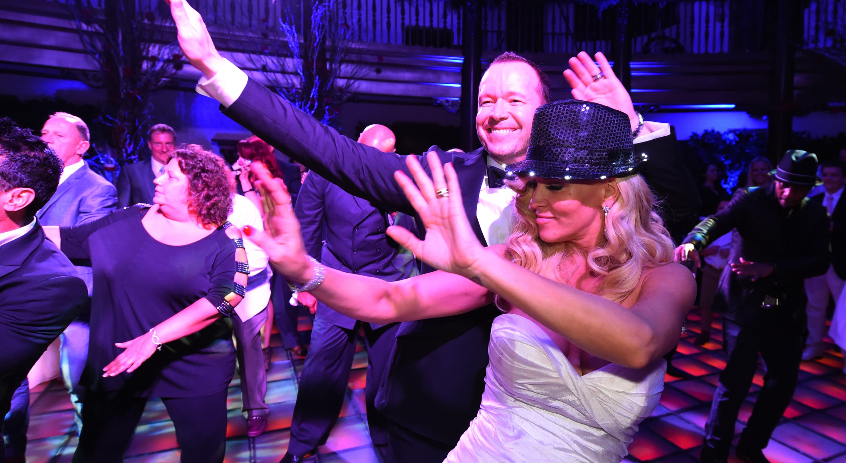 Donnie Wahlberg and Jenny McCarthy dancing in the Rainbow Room at Hotel Baker for their wedding reception