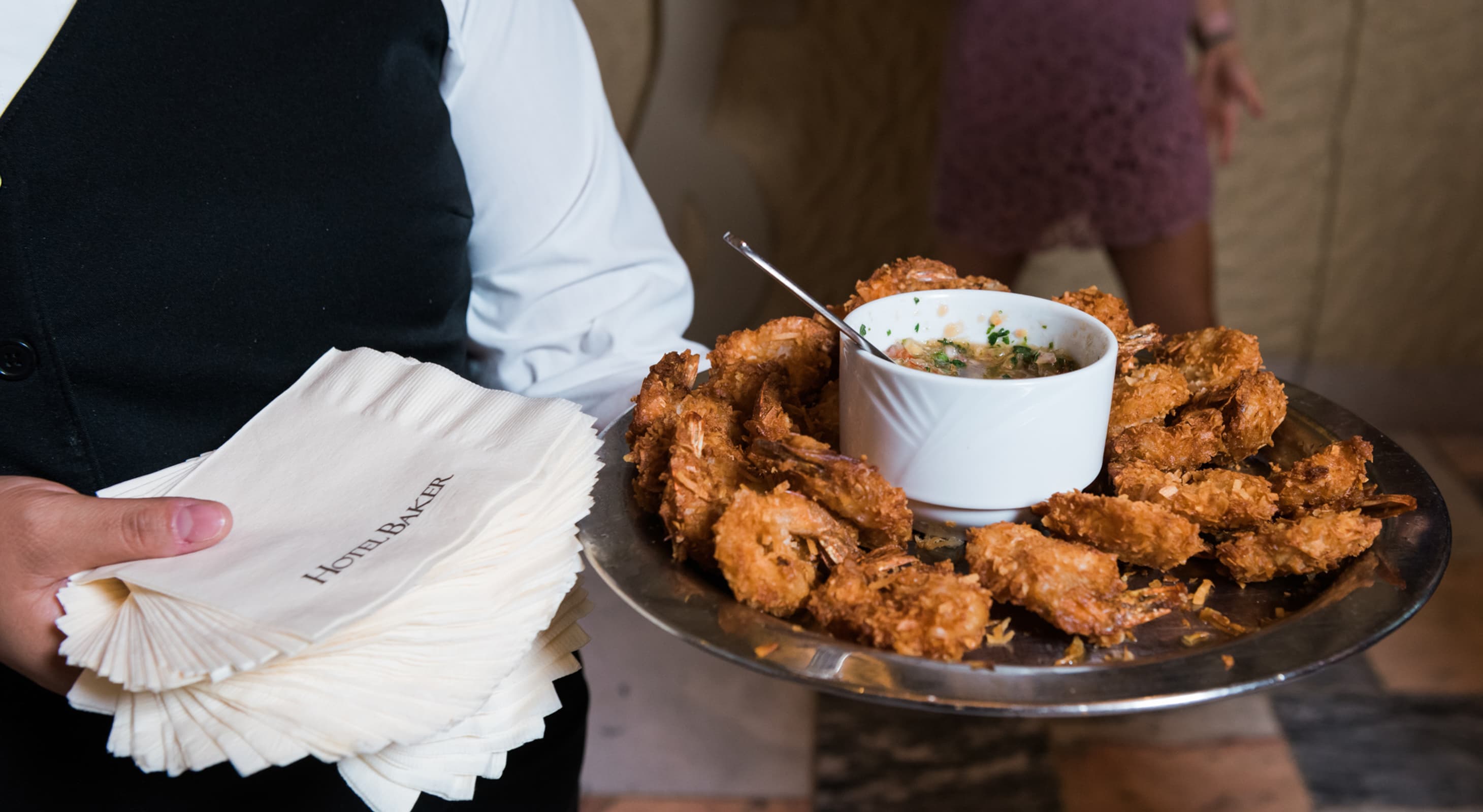 Server at special event in St. Charles, IL with plate of shrimp
