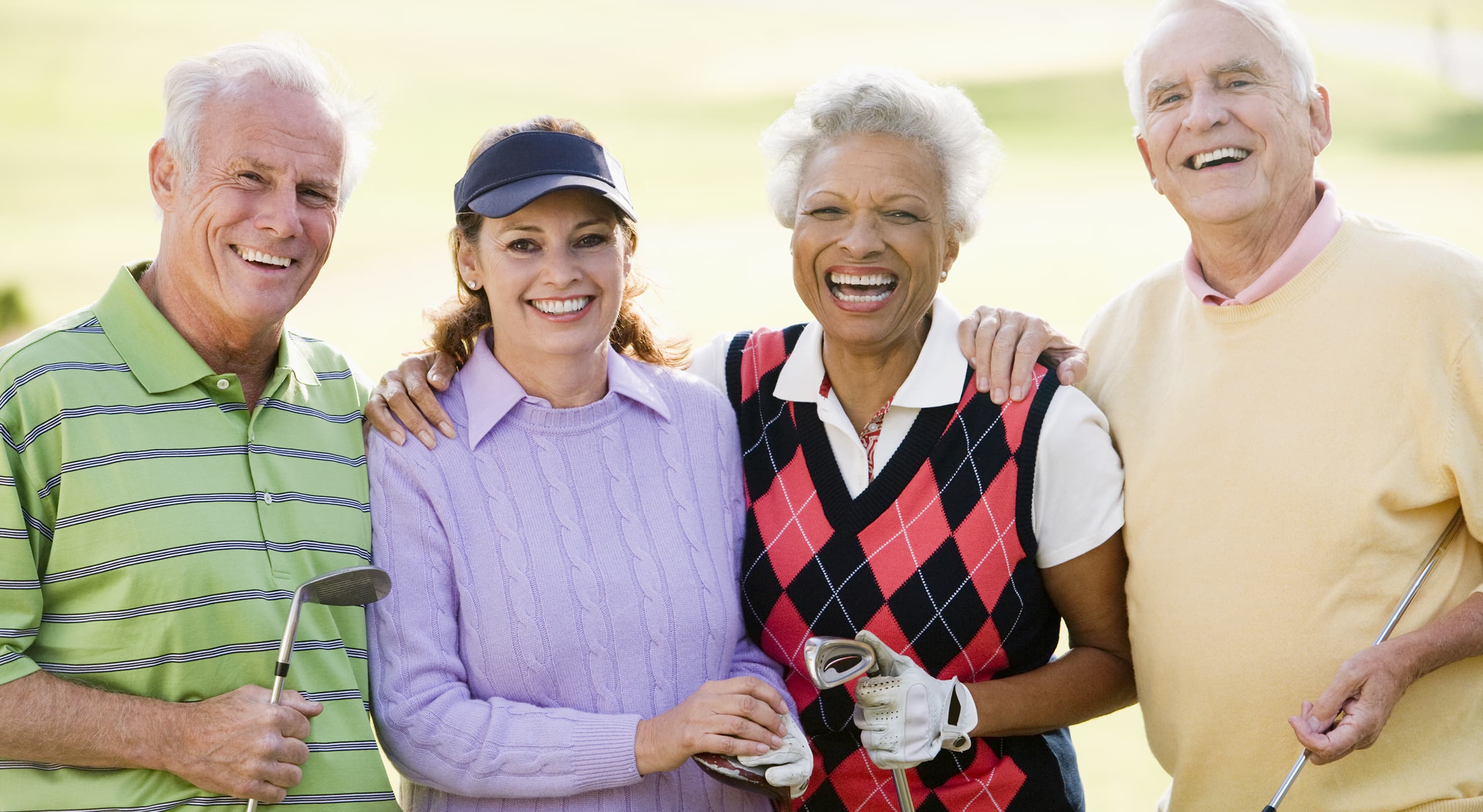 Group of mature friends playing golf together