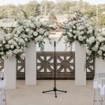 Wedding ceremony setting along the Fox River at the boathouse