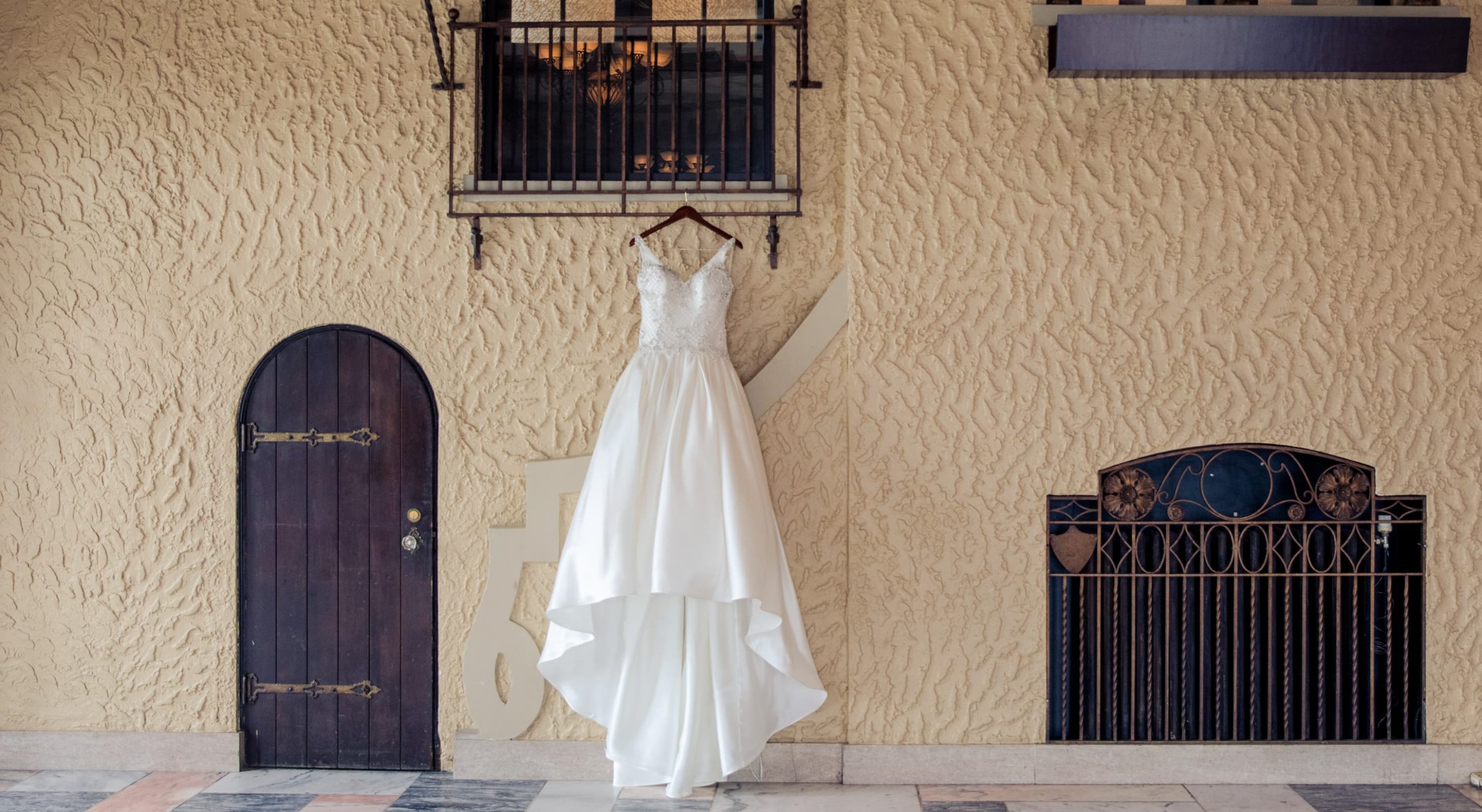 Wedding dress hanging on an exterior wall at a historic wedding venue in Illinois