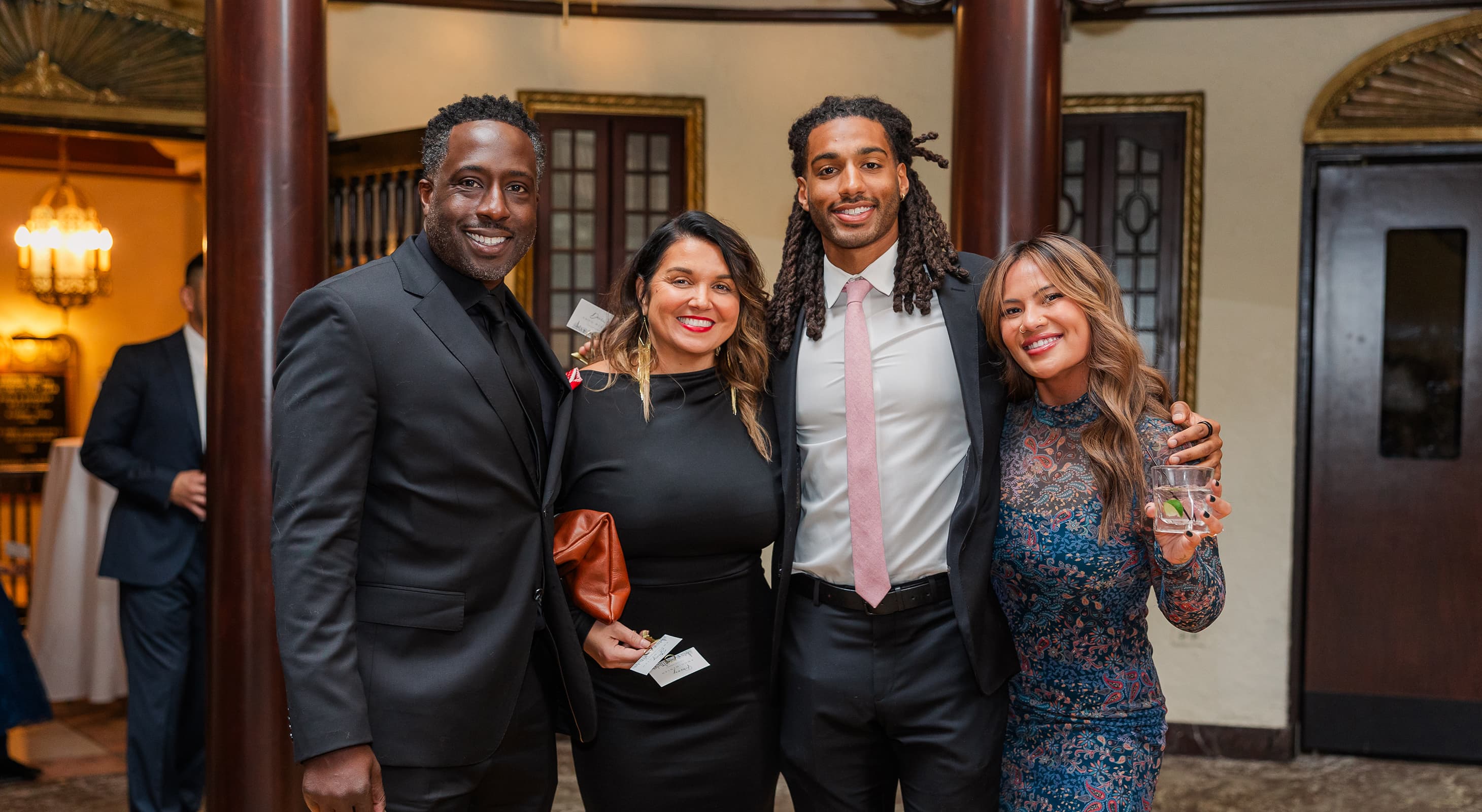 Event guests smiling for a photo in our event space near Chicago