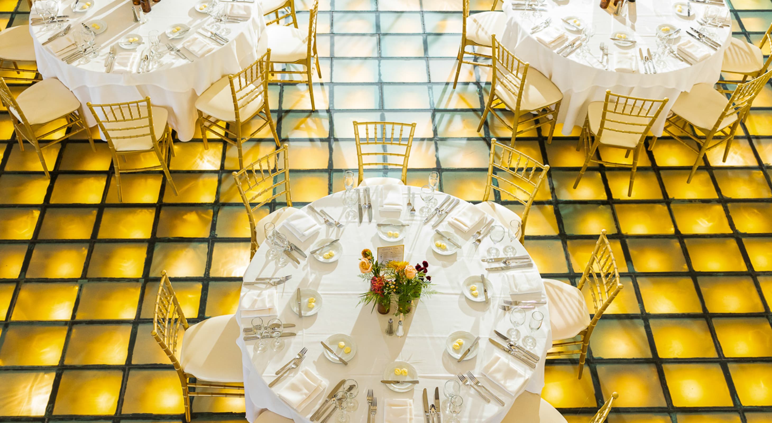 Event tables on a lighted floor